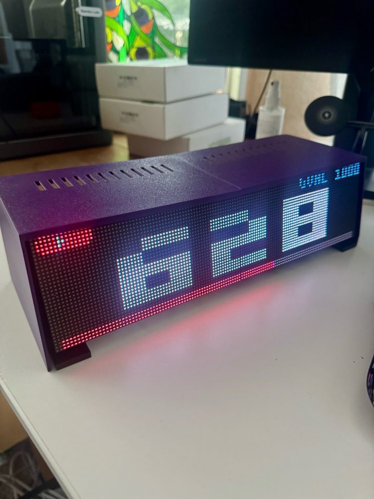 VibeMatrix, a purple LED bar built from two Waveshare RGB panels, showing large pixel numbers